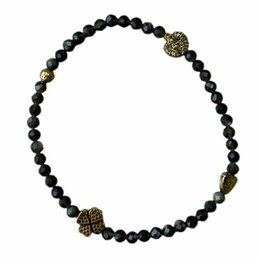 Dames armband zwarte Obsidiaan 3 mm met goudkleurige tussenkralen Dames armband zwarte Obsidiaan 3 mm met goudkleurige tussenkralen